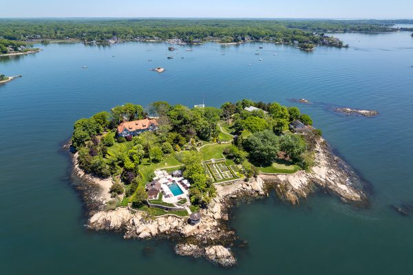 Aerial view of Rogers Island showcasing the mansion, lush gardens, and surrounding waters.