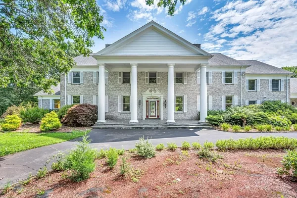 Stately brick mansion with grand columns and lush landscaping at 1 John Steele Rd, Farmington, CT